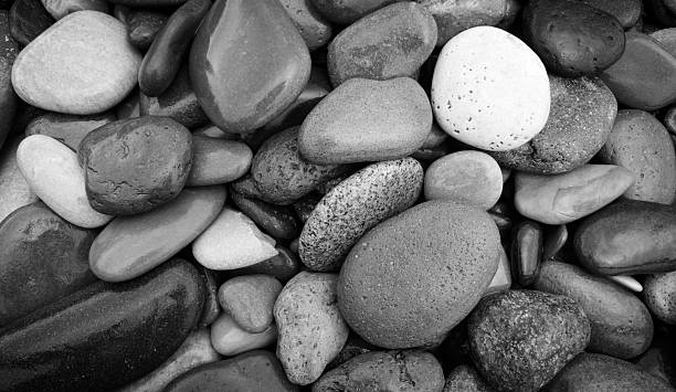 istock abstract black and white background with many round pebble stones 2227611109