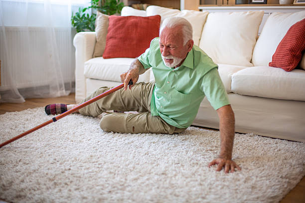 istock Senior man falling down on carpet at home with walking cane 2227611788