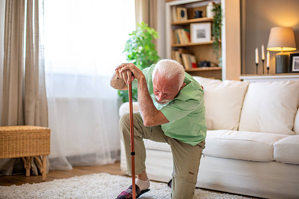 istock Senior man falling down at home, leaning on walking cane 2227611818