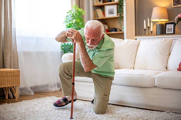 istock Senior man falling down at home, struggling to get up 2227611821