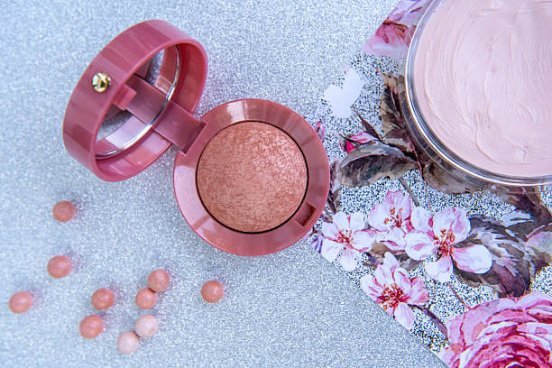istock Makeup products: blush, blush pearls and makeup base. 2227612001