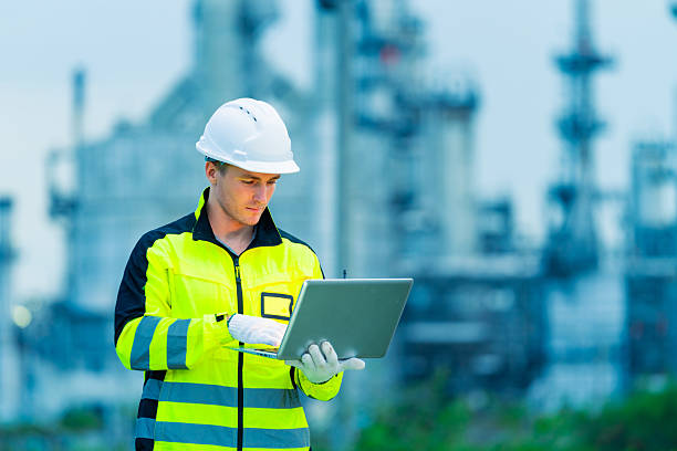 istock Male engineer working at oil refinery plant construction site. 2227613471