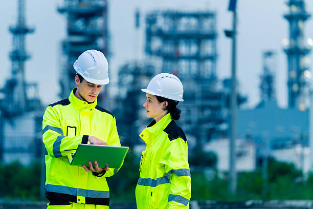 istock Engineers teamwork working at oil refinery plant construction site. 2227613476