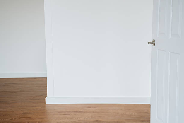 istock Empty Room with White Walls and Open Doorway to Bright Space 2227615530