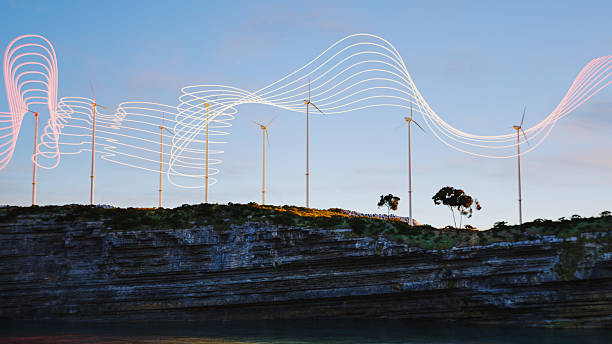 istock Glowing lines flowing along wind turbines 2227616491