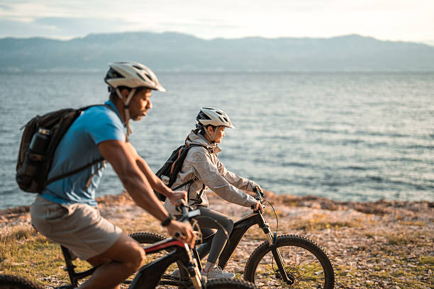 istock Diverse Cyclists Enjoying Sunrise Mountain Biking by Adriatic Coast 2227617850