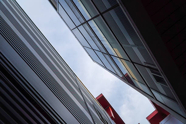 istock Low-angle view capturing the striking geometric interplay of modern building facades 2227623828