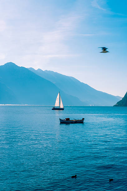 Garda lake Mountain view with boats in Riva del Garda, Trentino-South Tyrol, Italy