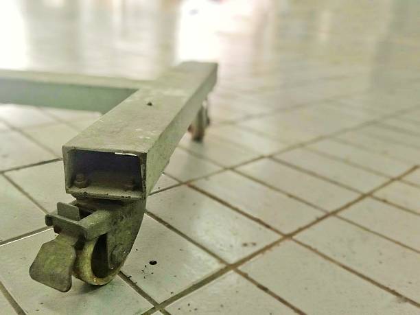 istock trolley wheel with blurred floor background 2227632323