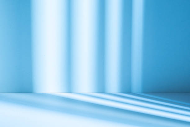istock Studio style background wall decoration presentation uses white and blue tones. with shadows cast from a nearby window, concept creating a decorative 2227634231