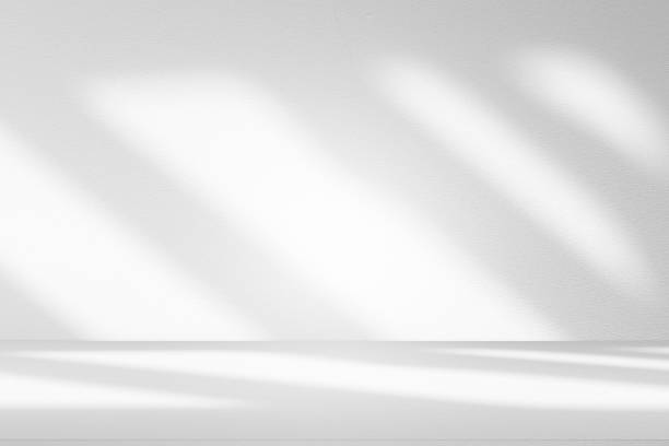istock Wall interior background, studio and backdrops show products.with shadow from window color white . background for text insertion and presentation product 2227634287
