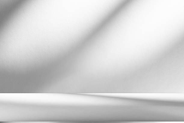 istock Wall interior background, studio and backdrops show products.with shadow from window color white . background for text insertion and presentation product 2227634317