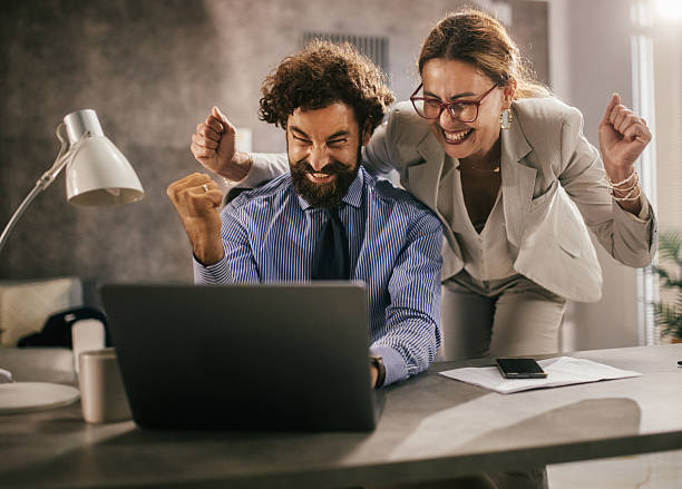 istock Busineness team celebrates a major success in the office, big win 2227636611