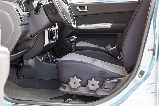 istock Comfortable front seats inside the car: the driver and passenger, tied with black fabric trim, modern interior design, the steering wheel covered and a luxurious center console. 2227638517