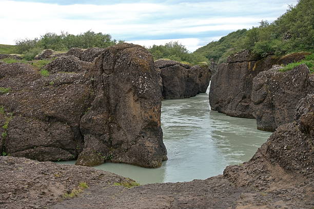 istock River flowing among volcanic rocks 2227638525