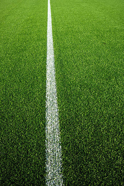 istock green artificial turf with a clean white line 2227641499