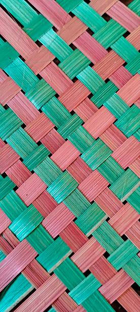 istock woven bamboo with red and green motifs 2227642180