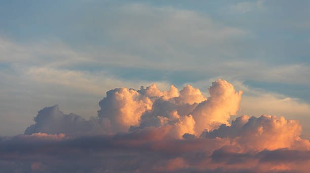 istock Golden Sunset Clouds Illuminated in the Evening Sky 2227643422