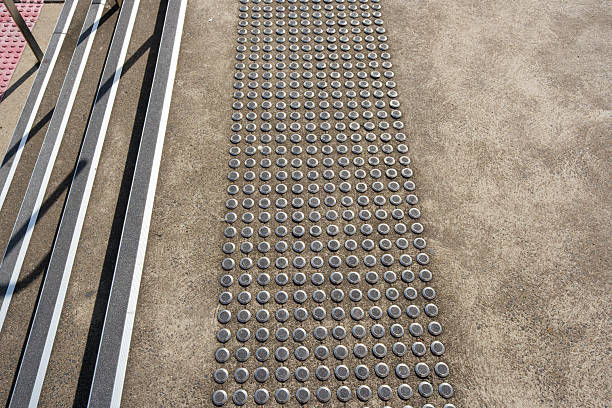 Rubber and metal grip material on outdoor steps and walkway.