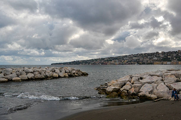 Naples, or Napoli in Italian, is a vibrant city in southern Italy, known for its rich history, culture, and delicious cuisine. It's the third-largest city in Italy and the regional capital of Campania, situated on the coast of the Bay of Naples, near Mount Vesuvius.