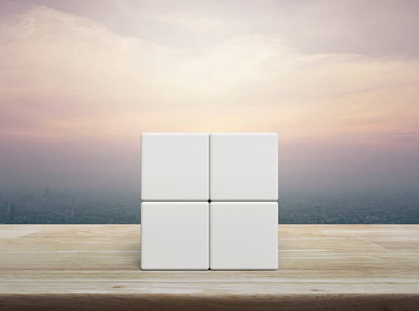 istock Four white block cubes on wooden table 2227648267