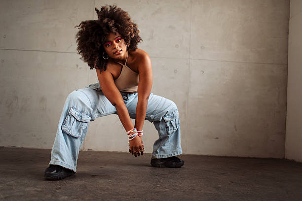 Hip hop dancer dancing in a cool studio with neon lights.