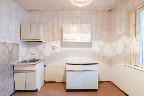 istock Old Kitchen Interior with White Cabinets and Brightly Lit Space. Old Retro Soviet Style Home Kitchen Interior 2227648581