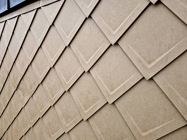 istock cladding of a building with expanded metal lattice structure. galvanized gray nets protect the industrial building. contrast to a silver background, wall, corner, slanted, sheet metal, cladding, lined 2227649216