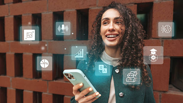 Young woman smiles while using smartphone in front of brick wall with digital icons representing technology and education