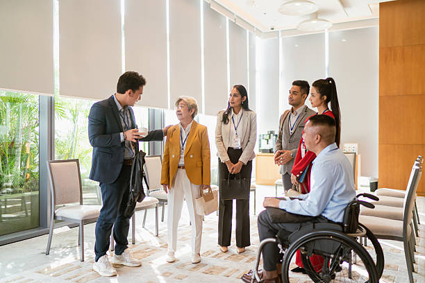 istock Asian senior female leadership in a diverse business networking session 2227649911