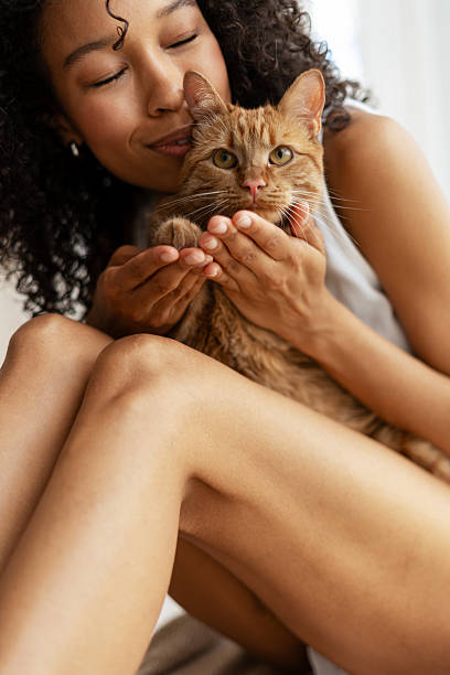 istock Woman Embracing Ginger Cat with Love 2227652259