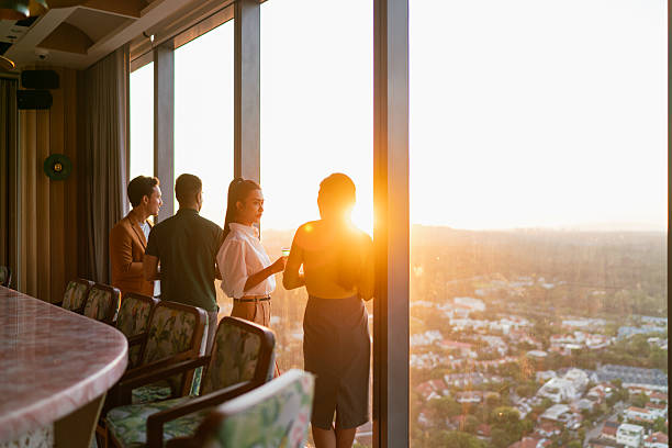 istock Diverse Asian co workers meet for cocktail after work hours 2227652405