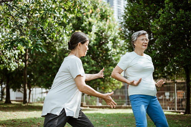 istock Asian Seniors Practicing Tai Chi Partner Exercises 2227655794