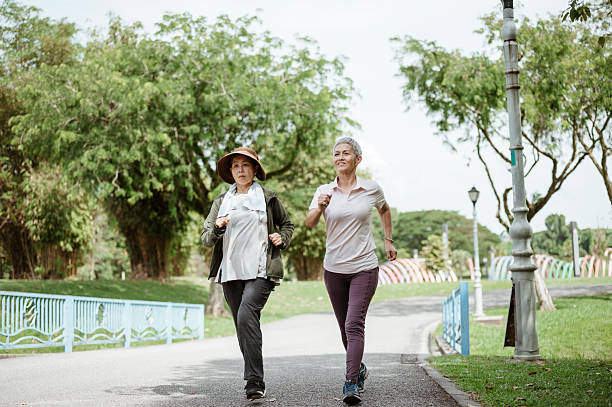 istock Active in Retirement: Senior Duo Enjoys a Morning Jog Together 2227655888
