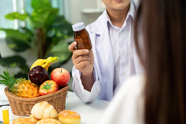 istock Nutrition Consultation: Doctor Advising Patient on Supplements 2227657617