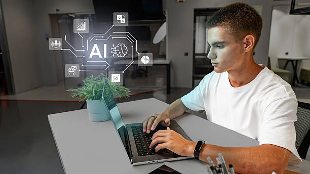 istock Young professional working with artificial intelligence concepts on a laptop in a modern office environment 2227660644