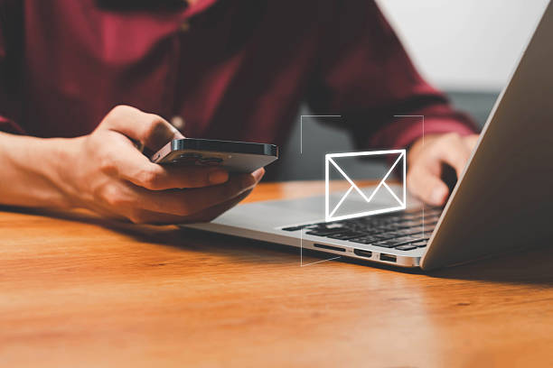 istock Email marketing concept, Human touch on email and surfing the internet with email icon, email icon, e-mail communication, e-mail marketing concept, send e-mail or news letter, online working internet. 2227667678
