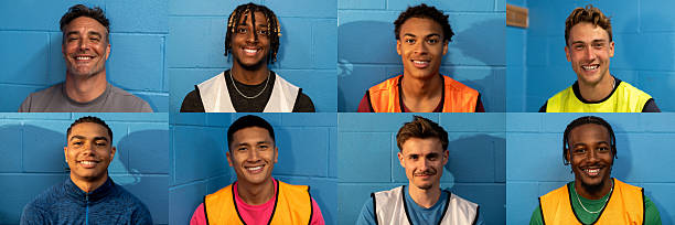 Young male football team collage. Headshot portraits side by side showing young male football players smiling while looking at the camera. They are at a football training ground in the North East of England, sitting in the locker room in front of a blue wall.
