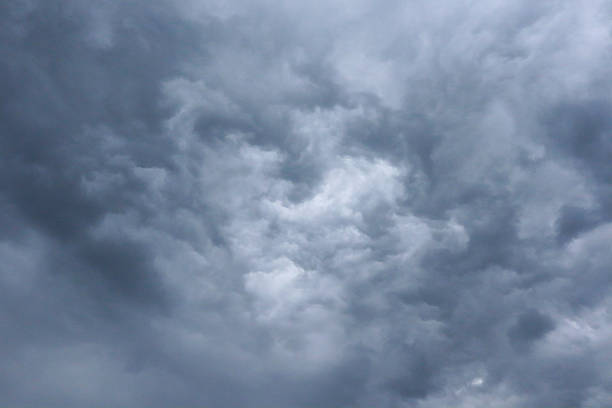 Natural formation of clouds resembling a heart shape in the middle of a dramatic, stormy sky. A rare and symbolic cloudscape, perfect for themes like love, emotion, mystery, and the power of nature. Ideal for romantic visuals, symbolic designs, or cinematic storytelling.