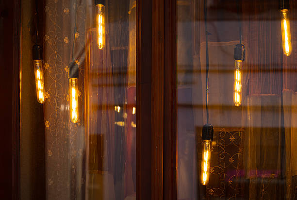istock hanging garland warm light lamps beyond the window with smooth glass surface foreground cozy interior dusk condition 2227670916