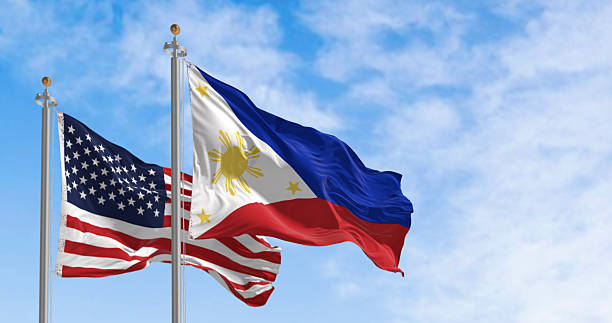 istock Philippines and US national flags waving in the wind 2227671044