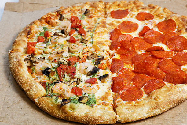 istock Closeup assorted pizza from cardboard box. Shallow focus. 2227671407