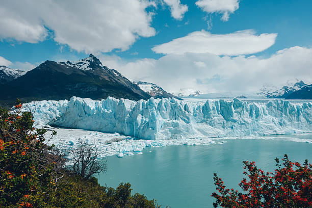 istock Perito moreno glacier melting into turquoise water under a cloudy sky 2227671597