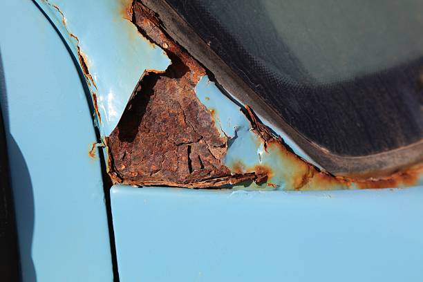 Old car wreck fit for scrap on a meadow
