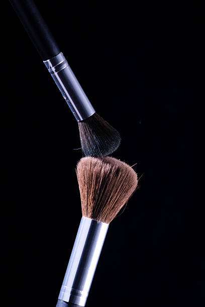 istock One brush, positioned diagonally from the upper left, has dark bristles and a 2227673282