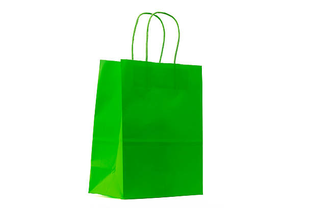 A vibrant green paper shopping bag with handles, set against a plain white