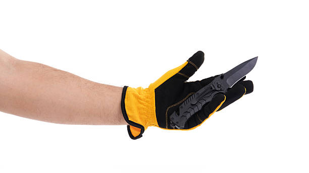 istock Hand in glove holding a folding knife in position 2227678011