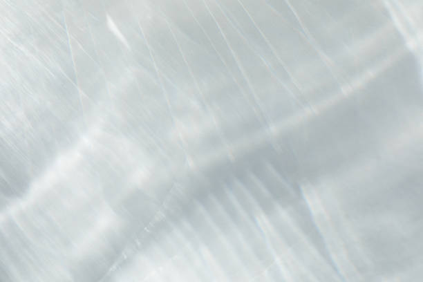 Abstract sunlight shadows background with flare and glare. Natural abstract aesthetic mockup with caustic effects for design and modern presentation.