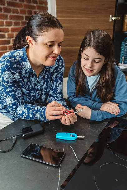 istock Happy family checking multi purpose knife while preparing 72 hours survival kit in kitchen 2227679070