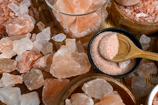 Himalayan salt - various types and sizes on a table - close up shot